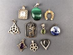 A collection of ten white metal pendants of variable designs. Some marked 925 for sterling silver.