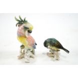 A Karl Ens porcelain figure of a parrot, 19cm high and another of a finch, 9cm high,