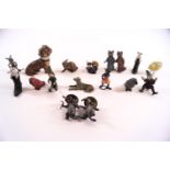 A collection of small painted lead figures, mainly animals, comprising a dog with toothache,