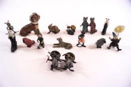 A collection of small painted lead figures, mainly animals, comprising a dog with toothache,