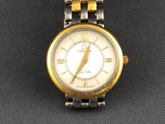 A yellow and white metal Omega Deville bracelet wristwatch. Quartz movement.