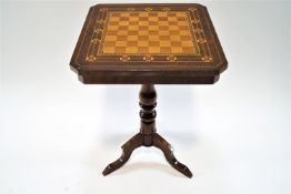 A 20th century mahogany inlaid chess table with chequer board top