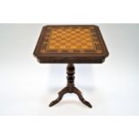 A 20th century mahogany inlaid chess table with chequer board top