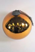A witch's ball in a bronzed finish,