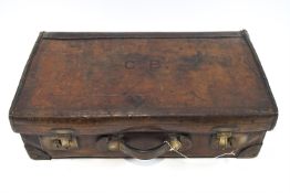 A Barrett and Sons of Piccadilly cartridge case in calf skin with metal lining,