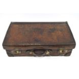 A Barrett and Sons of Piccadilly cartridge case in calf skin with metal lining,