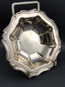 A silver bonbon dish of hexagonal form with lobed edges and a gadrooned border, Chester 1910,
