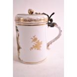 A 19th century Meissen style porcelain tankard and hinged cover,