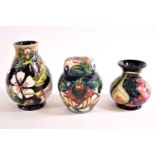 Three pieces of Moorcroft : A ginger jar decorated with tiger lilies,