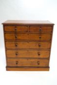 A mid 19th century chest of two short and four long drawers veneered in partridge wood