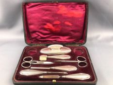 A cased silver part manicure set