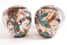 A 20th century Japanese earthenware garniture comprising; a pair of octagonal crackle glaze vases,