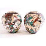 A 20th century Japanese earthenware garniture comprising; a pair of octagonal crackle glaze vases,