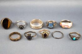 A collection of ten white metal rings of variable designs. Some are marked for silver 925.