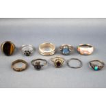 A collection of ten white metal rings of variable designs. Some are marked for silver 925.