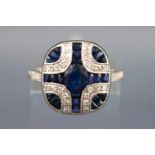 A white metal dress ring. Set with an oval faceted cut principal sapphire of approx. 0.61cts.