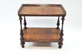 A walnut two tier whatnot, with turned and carved supports on turned legs, 55cm high, 61cm wide,