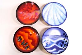 A set of four Poole Pottery limited edition plates,'The Elements' with boxes and certificates,