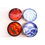 A set of four Poole Pottery limited edition plates,'The Elements' with boxes and certificates,