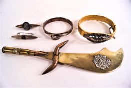 Five pieces of Trench art, including a bangle, a hinged bangle and two brooches