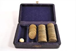 A boxed set of 18th century Spade guinea style brass gaming counters,