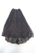 A 19th century black lace overlay skirt