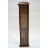 An oak cased Admiral Fitzroy barometer, of plain form, set with two sliding brass indicators,
