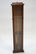 An oak cased Admiral Fitzroy barometer, of plain form, set with two sliding brass indicators,