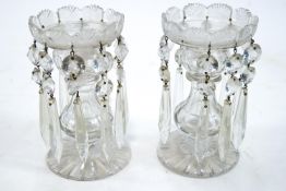 A pair of 19th century cut glass table lustres, each suspending glass drops,