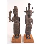 Two Nigerian twentieth century Benin cast bronze figures representing an Uzama ...
