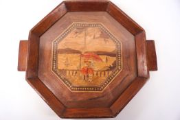 An Art Deco drinks tray in various hardwoods, of octagonal form,