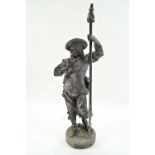 A cast metal statue of a man in Van Dyck style costume with a hat and georgette plate,