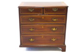 An Edwardian mahogany and satinwood cross banded and marquetry chest of drawers