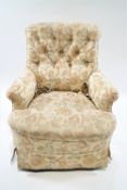 A Victorian button back armchair on turned tapering legs with brass and ceramic casters, 86cm high,