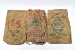 Six vintage hessian feed sacks,