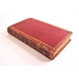 A red Morocco bound copy of The Book of Common Prayer 1785