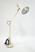 A white anglepoise lamp,