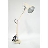 A white anglepoise lamp,