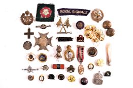 A bag of militaria items including buttons, cloth, patches,