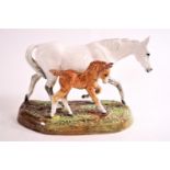 A Doulton horse group of a dapple grey mare and foal,