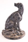 A cast iron door porter, in the form of a seated dog,