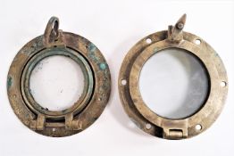 A pair of brass miniature portholes,