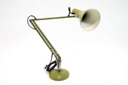 A green anglepoise lamp,