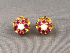 A yellow metal pair of cluster stud earrings