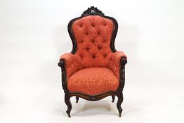 A Victorian ladies carved mahogany armchair,