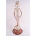 An Art Deco white marble carving of a girl, signed (?) Schmid on a brown marble socle,