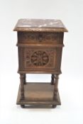 A 20th century carved marble topped pot cupboard,on turned feet, 87cm high, 44cm wide,