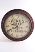 A mahogany cased round wall clock, the painted dial advertising "Venus Soap Saves Rubbing",
