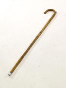 A pony measuring stick in bent bamboo, set a cameo,