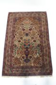 A Persian style rug with a central urn of flowers,